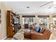 Relaxing living room with leather seating and view to kitchen at 12531 Se 90Th Ter, Summerfield, FL 34491