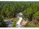 Aerial view of a house in a wooded area at 1280 Nw Redwood Dr, Dunnellon, FL 34431