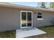 Back patio with sliding glass door at 1280 Nw Redwood Dr, Dunnellon, FL 34431