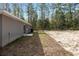 Rear view of house showing AC unit and small patio at 1280 Nw Redwood Dr, Dunnellon, FL 34431