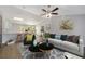 Open living room featuring a gray sofa, two-toned coffee table, and decorative pillows at 1280 Nw Redwood Dr, Dunnellon, FL 34431