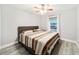 Spacious bedroom with king-size bed and wood-look flooring at 13198 Sw 29Th Cir, Ocala, FL 34473