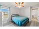 Cozy bedroom with a full-size bed and ceiling fan at 13198 Sw 29Th Cir, Ocala, FL 34473