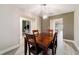 Cozy dining room with hardwood floors and a wood dining table at 13198 Sw 29Th Cir, Ocala, FL 34473