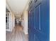 Light-colored hardwood floors and a blue door at 13198 Sw 29Th Cir, Ocala, FL 34473