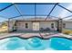 Inviting kidney-shaped pool with screened enclosure at 13198 Sw 29Th Cir, Ocala, FL 34473