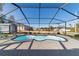 Enjoy this screened in kidney shaped pool at 13198 Sw 29Th Cir, Ocala, FL 34473