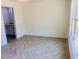 Well-lit room featuring a window and sleek flooring; ideal for a guest or room at 13253 Se 35Th Ct, Belleview, FL 34420