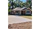 Charming one-story home featuring a new driveway, modern windows and a neutral color scheme at 13253 Se 35Th Ct, Belleview, FL 34420