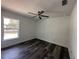 Well-lit bedroom with wood-look flooring and ceiling fan at 13766 Sw 115Th Pl, Dunnellon, FL 34432