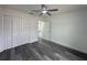 Bright bedroom with grey flooring and double doors leading to a spacious closet at 13766 Sw 115Th Pl, Dunnellon, FL 34432