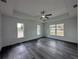 Spacious bedroom featuring wood-look flooring and ceiling fan at 13766 Sw 115Th Pl, Dunnellon, FL 34432