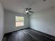 Spacious bedroom with wood-look flooring and a window at 13766 Sw 115Th Pl, Dunnellon, FL 34432