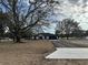 Front view of a single-story home with a paved driveway at 13766 Sw 115Th Pl, Dunnellon, FL 34432