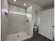 Large walk-in shower with marble tile and hexagon floor tile at 13766 Sw 115Th Pl, Dunnellon, FL 34432