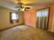 Bedroom with ceiling fan and peach colored accent wall at 14419 Sw 43Rd Court Rd, Ocala, FL 34473