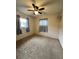 Bright bedroom with ceiling fan and neutral color carpet at 14419 Sw 43Rd Court Rd, Ocala, FL 34473