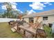 Spacious wooden deck with seating area, umbrella, and built-in planters at 16867 Sw 40Th Cir, Ocala, FL 34473