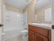 Well-lit bathroom with tub shower, toilet and vanity at 16867 Sw 40Th Cir, Ocala, FL 34473