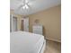 Bedroom with ceiling fan, dresser and large bed at 16867 Sw 40Th Cir, Ocala, FL 34473