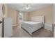 Spacious bedroom with ceiling fan and large window at 16867 Sw 40Th Cir, Ocala, FL 34473