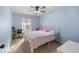 Light blue bedroom with full-size bed and a workspace at 2340 Ne 43Rd St, Ocala, FL 34479