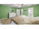 Bright bedroom with double bed, dresser, and en-suite bathroom at 2340 Ne 43Rd St, Ocala, FL 34479