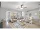 Living room with beige sofas and a bay window at 2340 Ne 43Rd St, Ocala, FL 34479