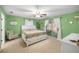 Main bedroom with a white bed frame and green walls at 2340 Ne 43Rd St, Ocala, FL 34479