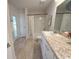 Clean bathroom, featuring a shower/tub combo and granite countertop at 25 Nw 113Th Cir, Ocala, FL 34482