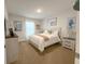 Guest bedroom with queen-size bed and coastal-themed decor at 25 Nw 113Th Cir, Ocala, FL 34482