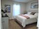 Bright bedroom with a king-size bed and large window at 25 Nw 113Th Cir, Ocala, FL 34482