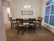 Elegant dining room features a large table and chandelier at 25 Nw 113Th Cir, Ocala, FL 34482