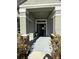 Front entrance with gray door and stone accents at 25 Nw 113Th Cir, Ocala, FL 34482