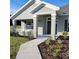 Charming front porch with white columns and railings at 25 Nw 113Th Cir, Ocala, FL 34482