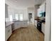 Modern kitchen featuring white cabinets, granite countertops and stainless steel appliances at 25 Nw 113Th Cir, Ocala, FL 34482