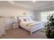 Spacious main bedroom with light-toned furniture and ample natural light at 25 Nw 113Th Cir, Ocala, FL 34482