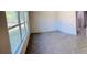 Bright bedroom featuring a large window, herringbone floors, and white walls at 2881 Se 140Th Pl, Summerfield, FL 34491