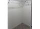 Walk-in closet featuring white walls, herringbone floors, and wire shelving at 2881 Se 140Th Pl, Summerfield, FL 34491