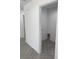 Bright pantry/closet features grey herringbone tile and white walls at 2881 Se 140Th Pl, Summerfield, FL 34491