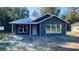 New construction home exterior, featuring a white door and windows at 2998 Se 140Th Ln, Summerfield, FL 34491