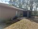 Backyard view showcasing a screened patio and additional seating area at 3 Maple Run, Ocala, FL 34472