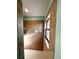 Brown tiled bathroom with shower and window at 3 Maple Run, Ocala, FL 34472