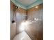 Shower stall with brown tile and built-in shelves at 3 Maple Run, Ocala, FL 34472