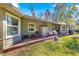 Long back patio with seating area and grill at 3650 Se 22Nd Ave, Ocala, FL 34471