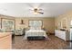 King-size bedroom with sitting area and large windows at 3650 Se 22Nd Ave, Ocala, FL 34471