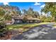 House exterior showcasing gray siding and a paved driveway at 3650 Se 22Nd Ave, Ocala, FL 34471