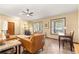 Living room with tile floors, ceiling fan, and ample natural light at 3650 Se 22Nd Ave, Ocala, FL 34471