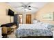 Spacious main bedroom with a large bed and TV at 3650 Se 22Nd Ave, Ocala, FL 34471