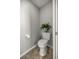 Small, well-maintained half bathroom with toilet and pedestal sink at 3660 Se 54Th Ave, Ocala, FL 34480